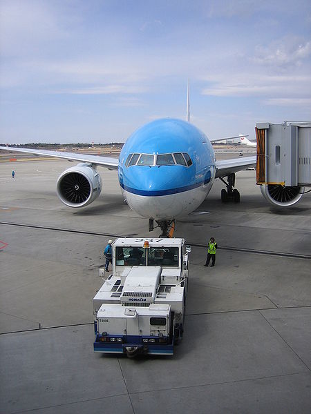  KLM Boeing 777 being pushed back from the gate at Narita International Airport. 